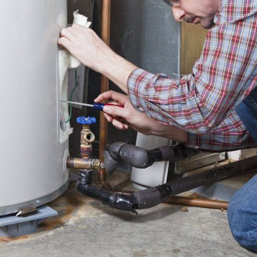 man checking the boiler