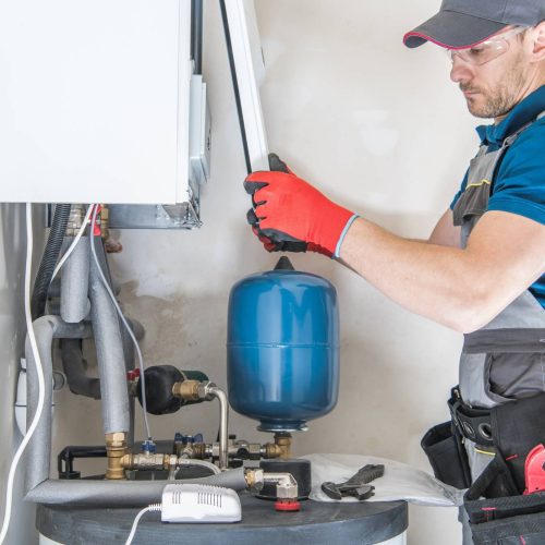 man installing the boiler