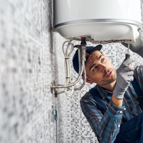 man fixing the boiler