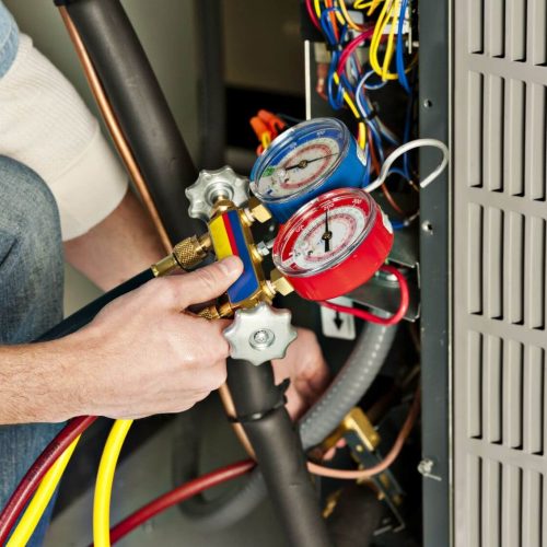 man checking gas on meter