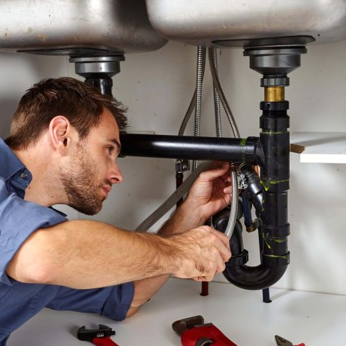 man repairing the pipe